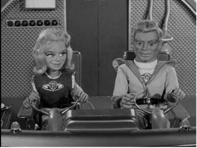 supermarionation Steve Zodiac and Venus on Fireball XL5 in outer space.